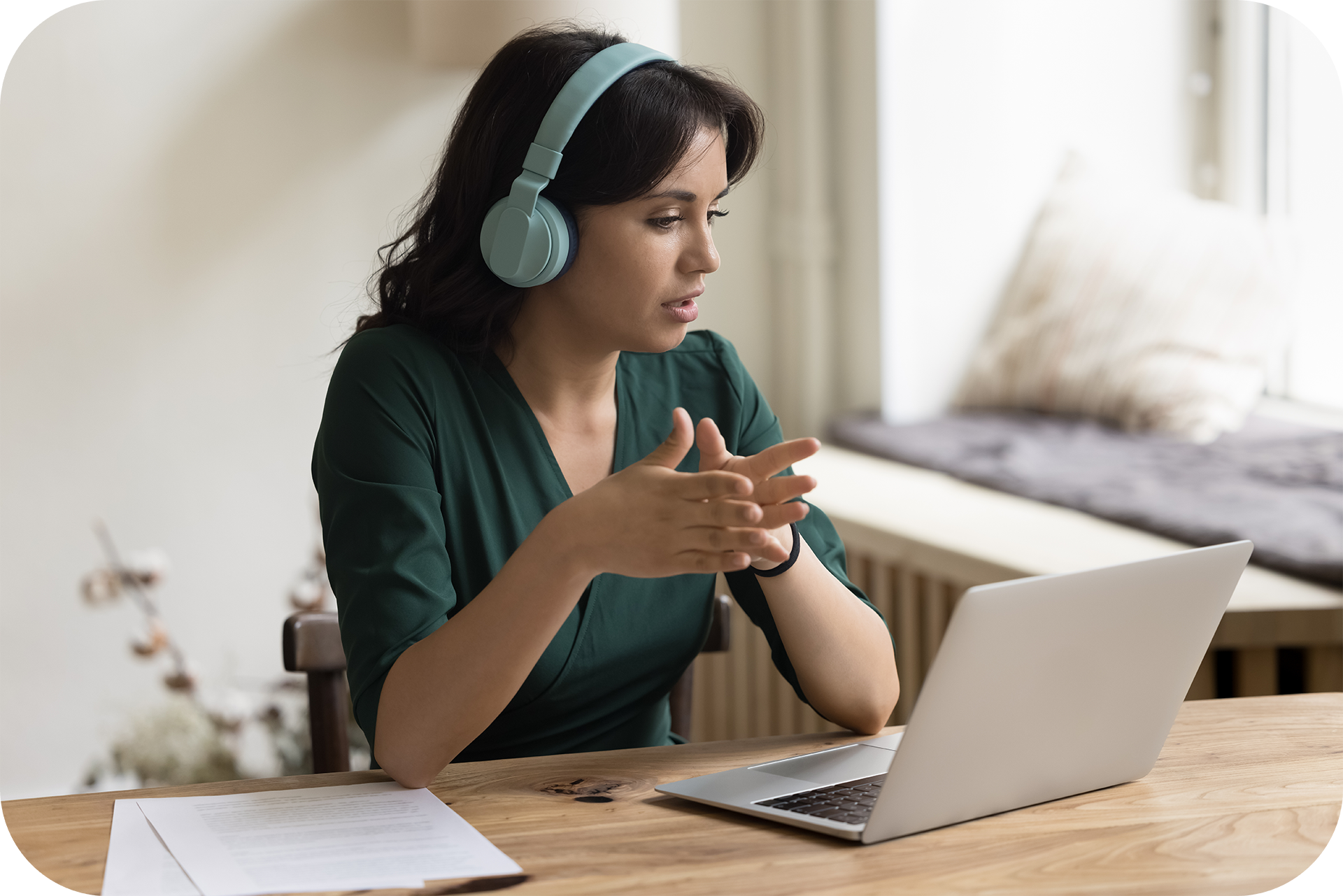 female using a laptop to video conference with others