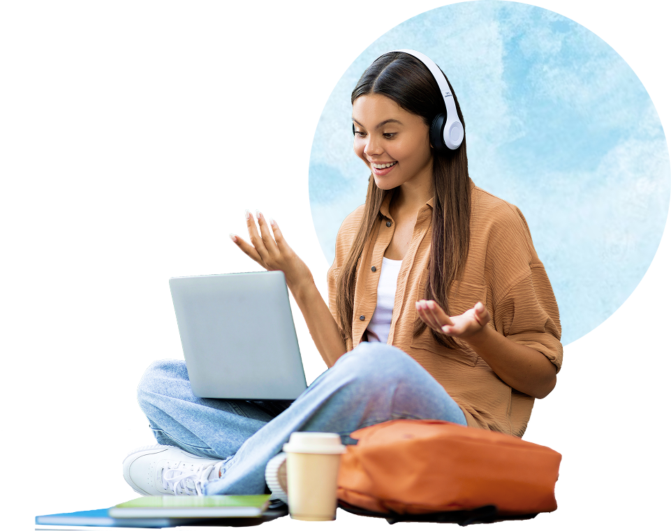 young woman being expressive with her hands while sitting crosslegged with laptop in her lap